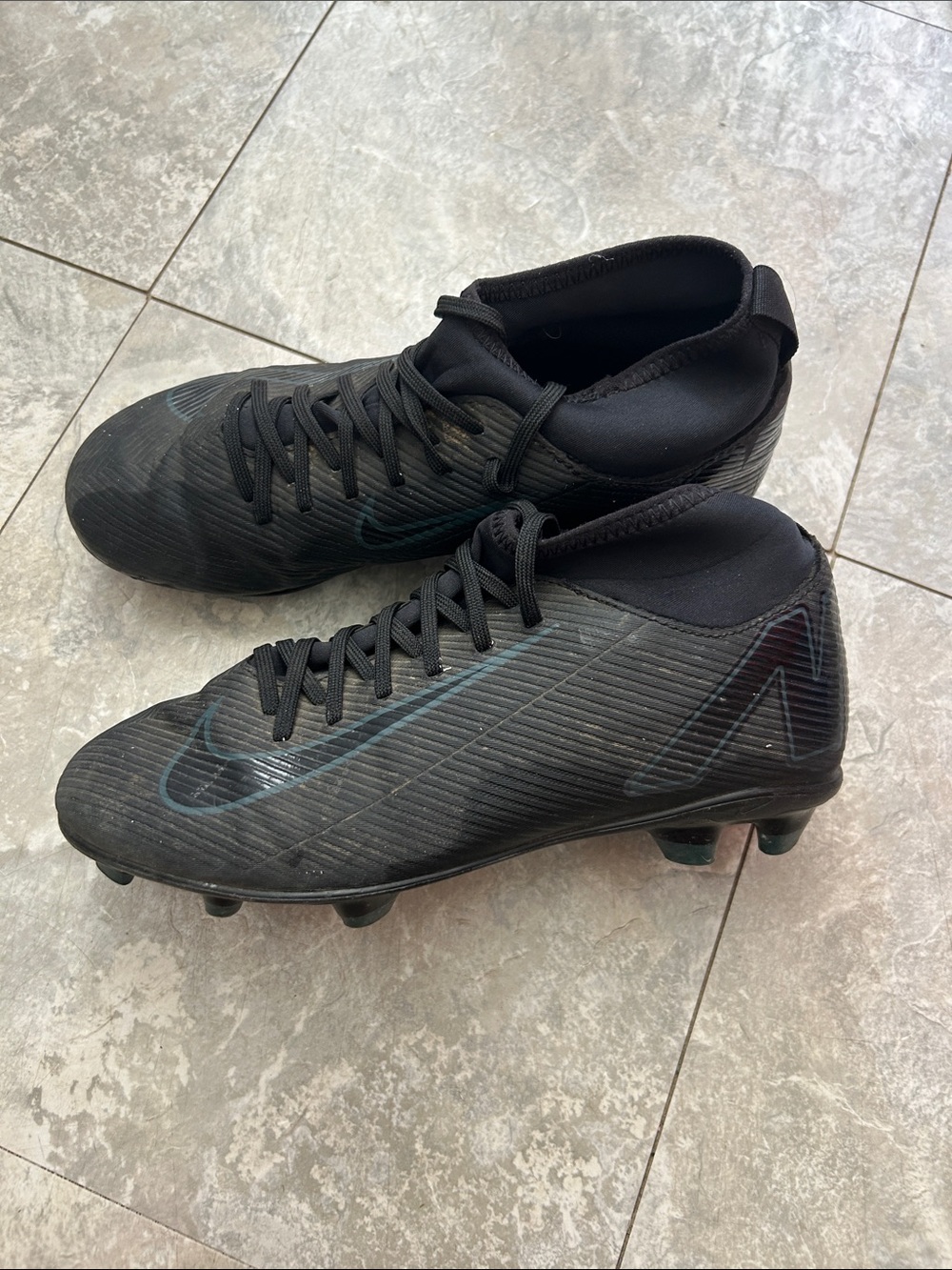 Nike Black Athletic Soccer Cleats with Subtle Teal Accent